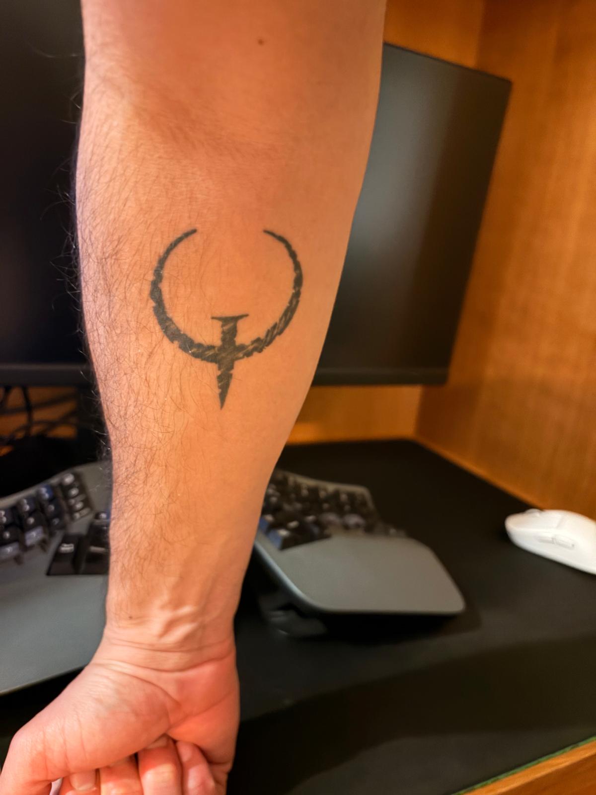 Quake logo tattoo